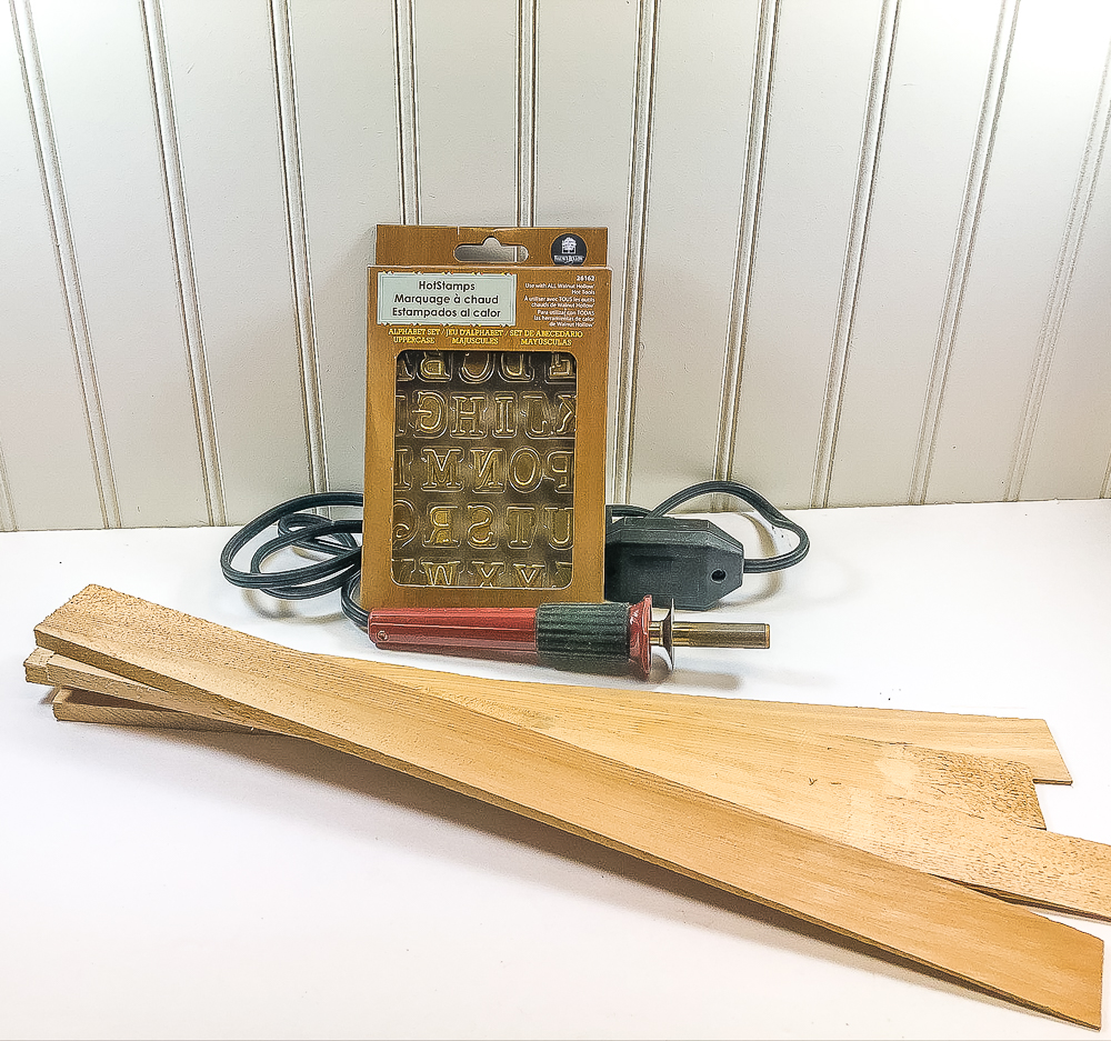 Materials needed to make DIY Wood Burned Plant Markers.