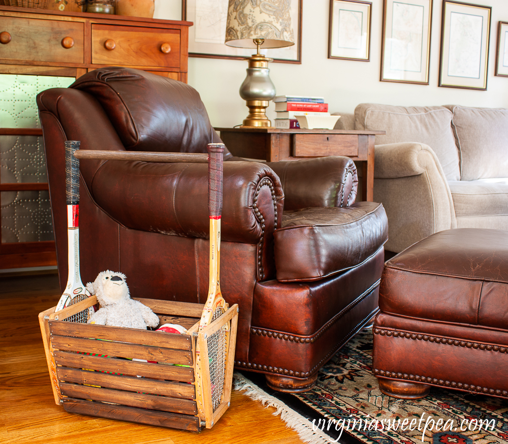 Basket made with vintage tennis rackets filled with dog toys.