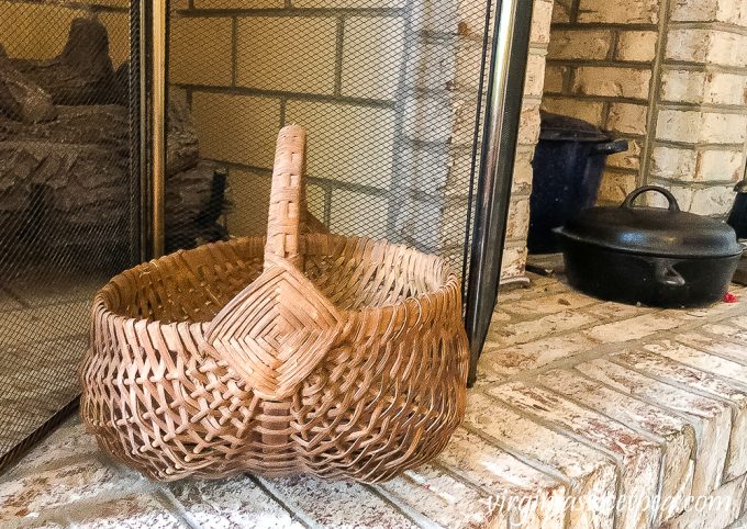 Vintage basket on fireplace hearth