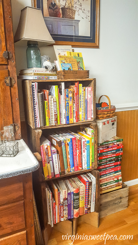 Stacked vintage crates filled with cookbooks