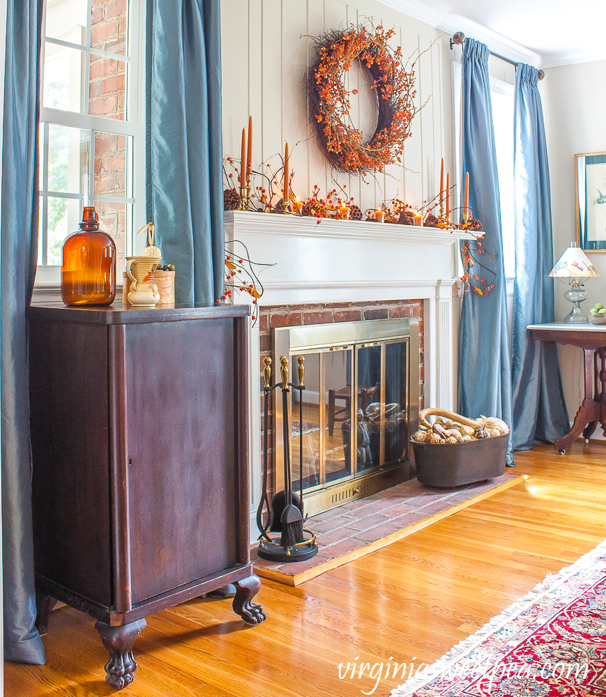 Fireplace and mantel decorated for fall