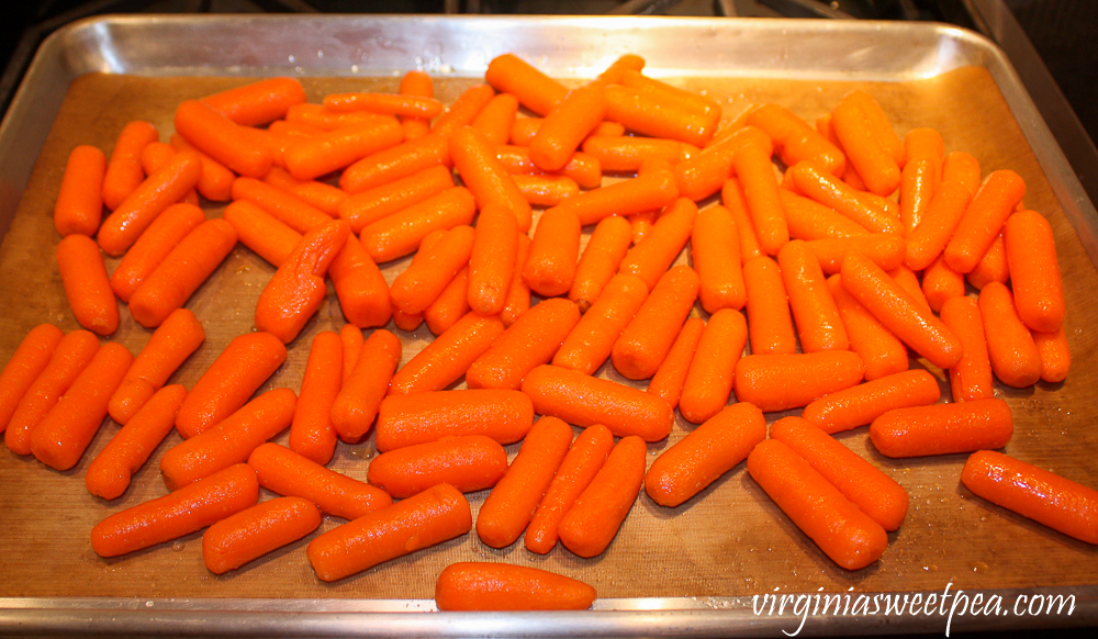 Raw carrots on a baking sheet