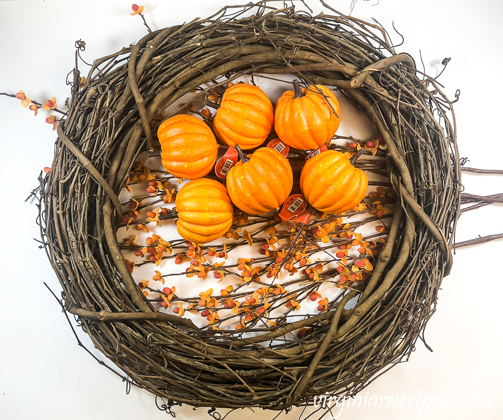 Grapevine wreath, pumpkin picks, and bittersweet pieces