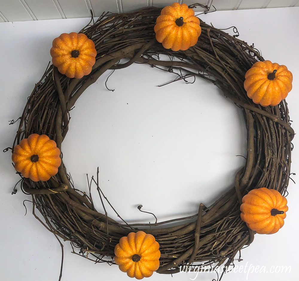 Grapevine wreath with six pumpkins