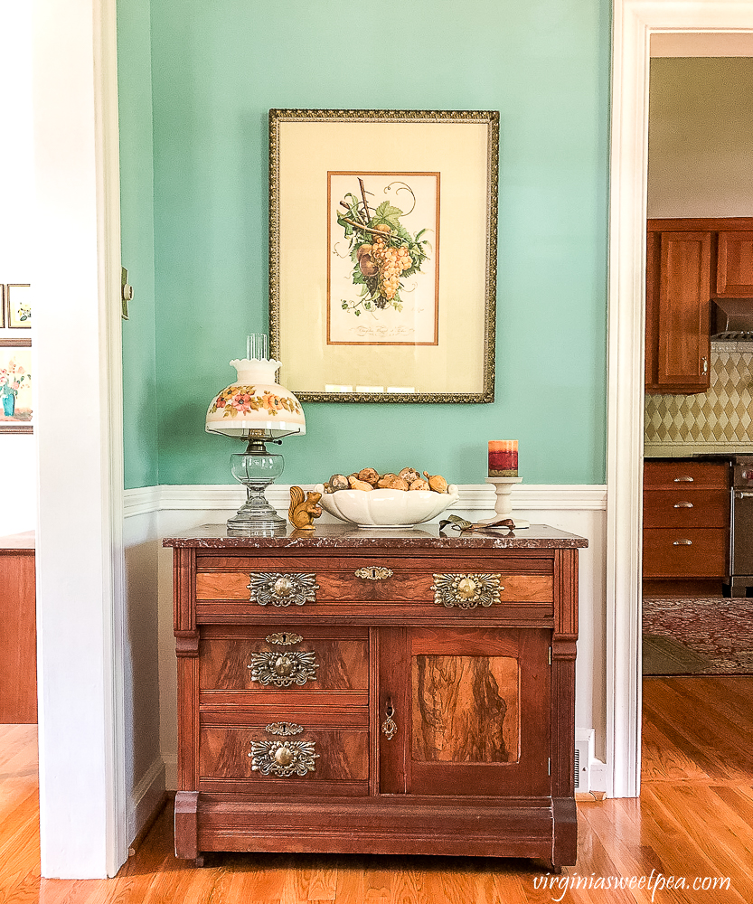 Antique marble topped chest decorated for fall.