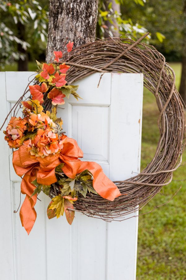 Fall wreath with fall foliage and an orange bow