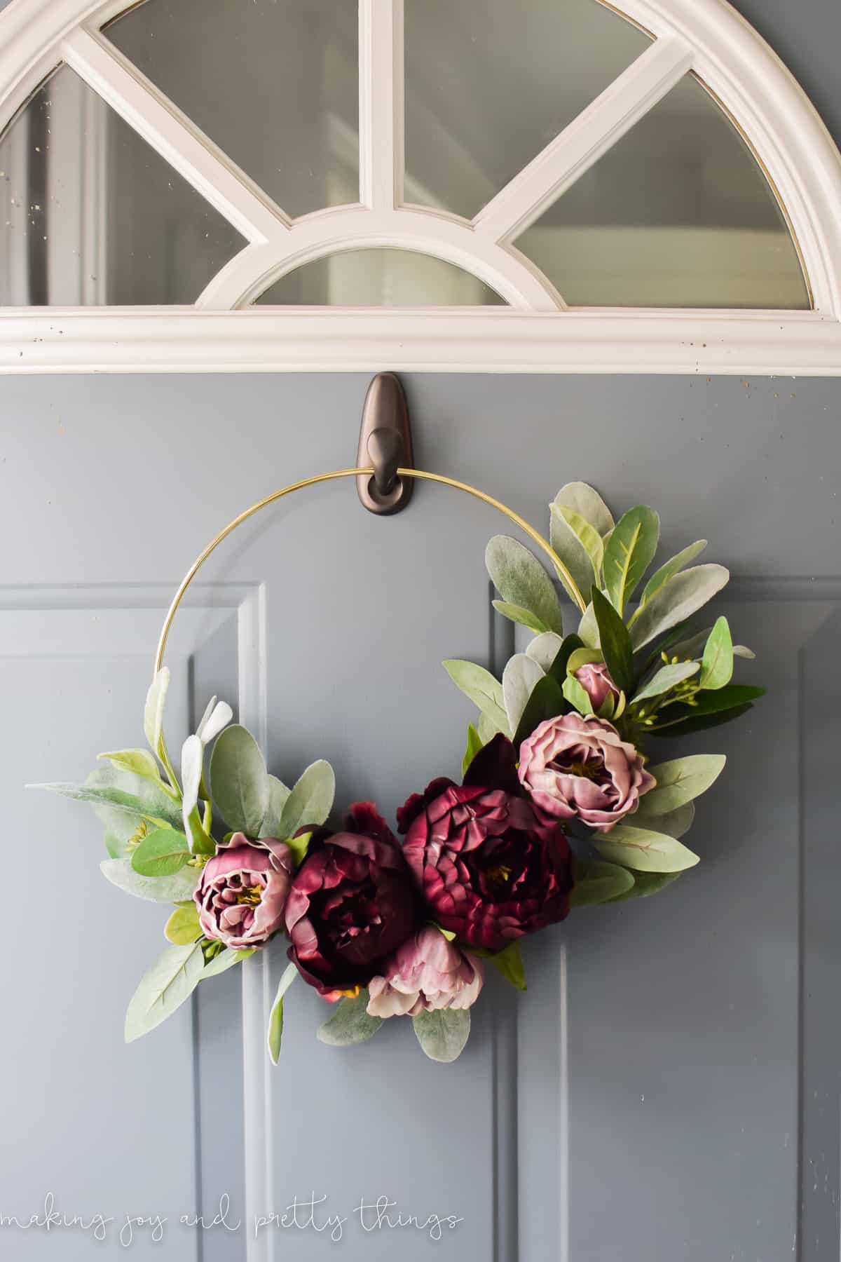 Fall hoop wreath with purple flowers and greenery