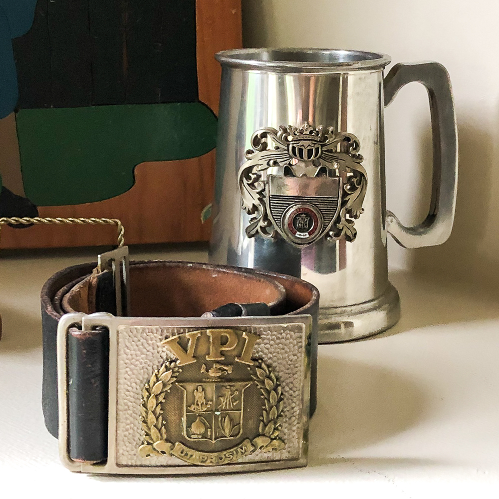 Virginia Tech corp of cadets belt with belt buckle from the late 50s to early 60s with a Virginia Tech metal mug