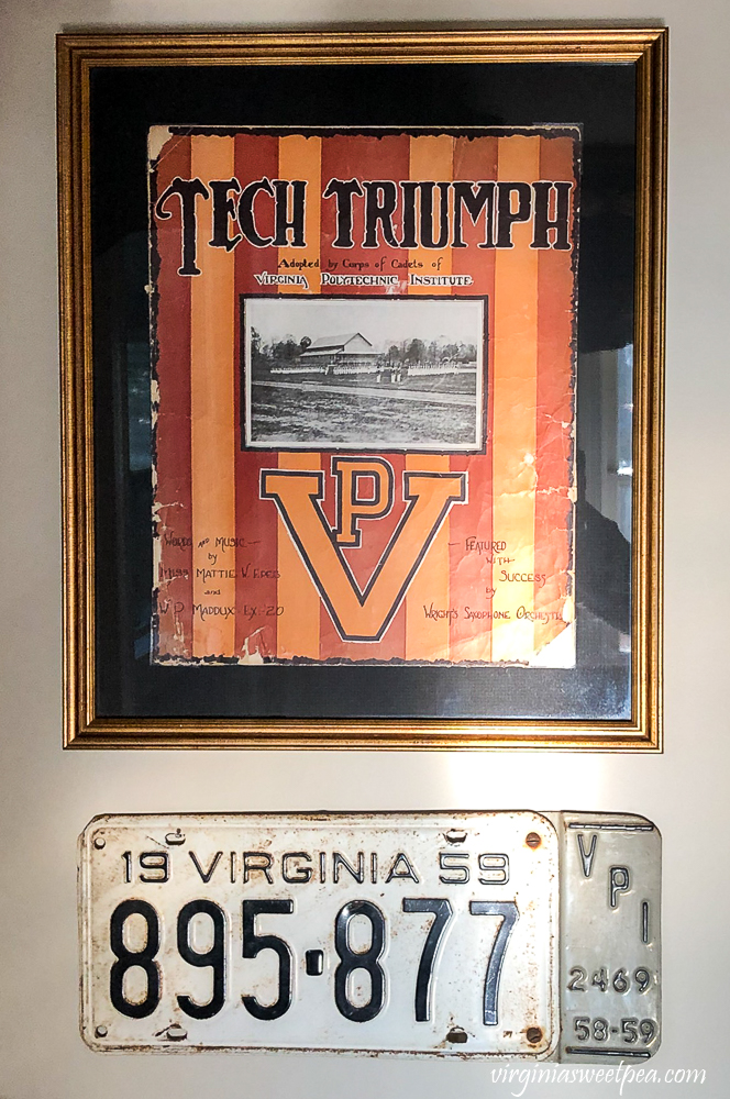 Framed Virginia Tech Tech Triumph sheet music from the early 1900s with a 1959 Virginia Tech license plate