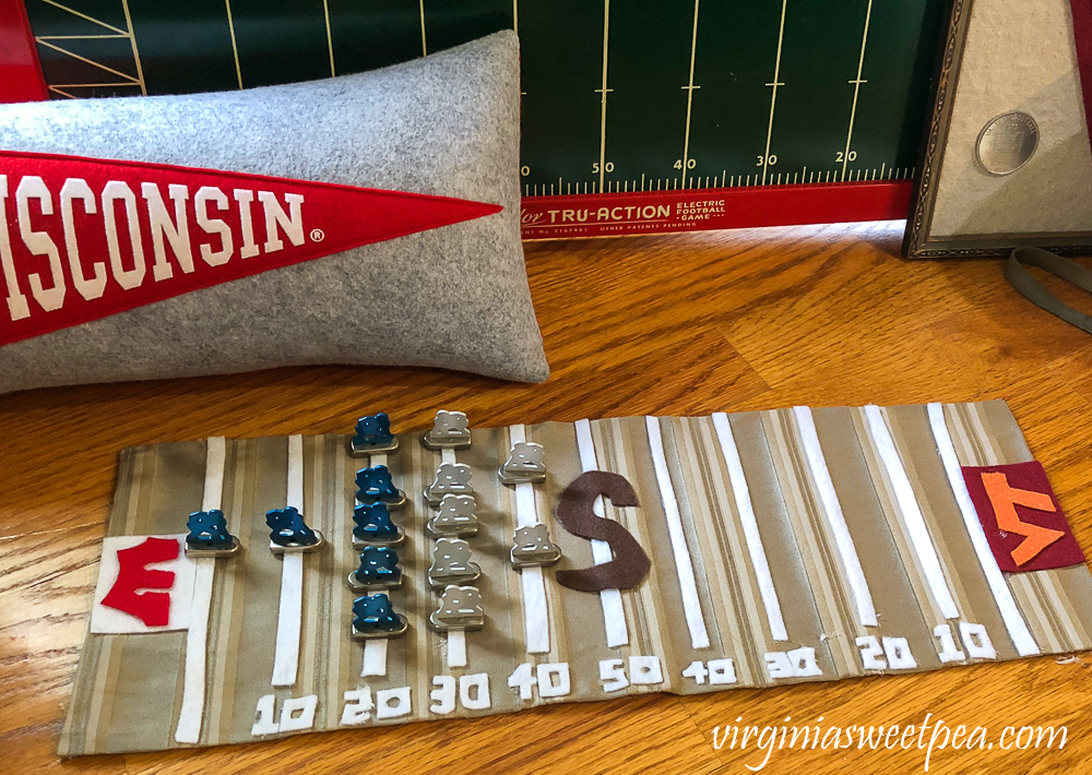 Wisconsin Badgers pennant pillow with handmade football playing field with metal players from Tudor Tru-Action Electric football game