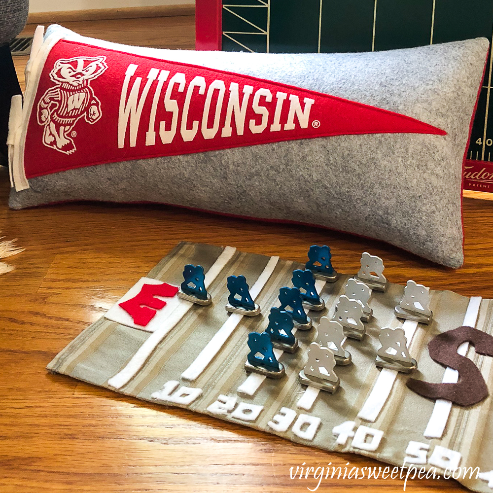 Wisconsin Badgers pennant pillow with handmade football playing field with metal players from Tudor Tru-Action Electric football game