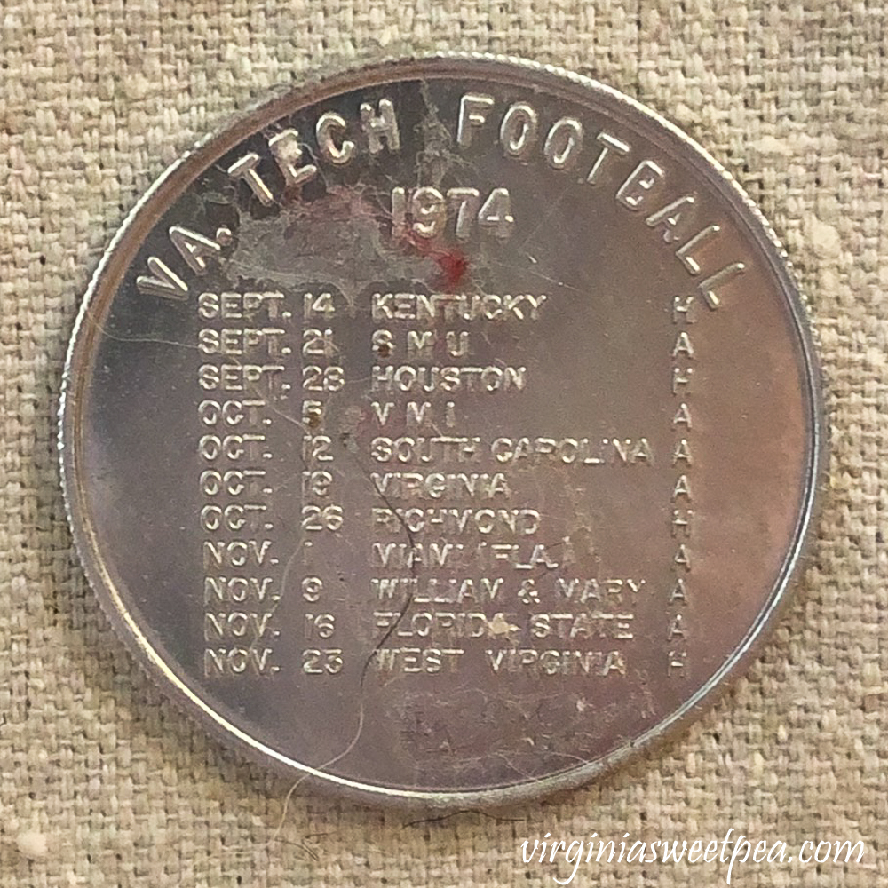 Coin with Virginia Tech football schedule for 1974