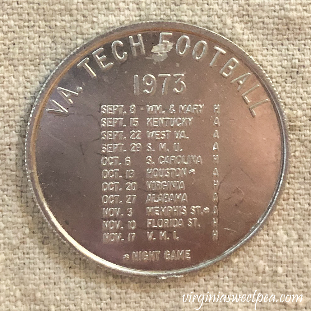 Coin with Virginia Tech football schedule for 1973