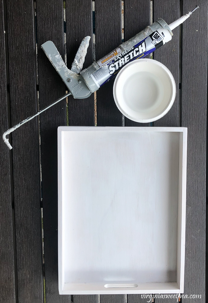 Caulking a wooden tray