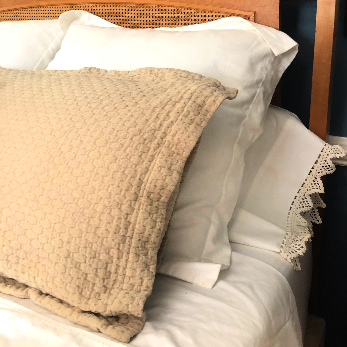 Layered pillows on a bed in a master bedroom