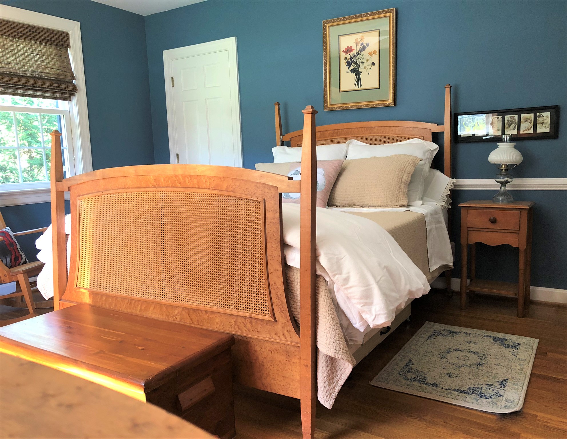 Master bedroom with blue walls and antique Bird's Eye Maple furniture