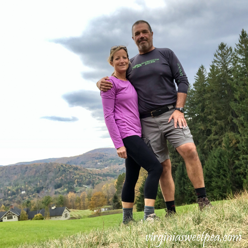 Couple with fall foliage in the background