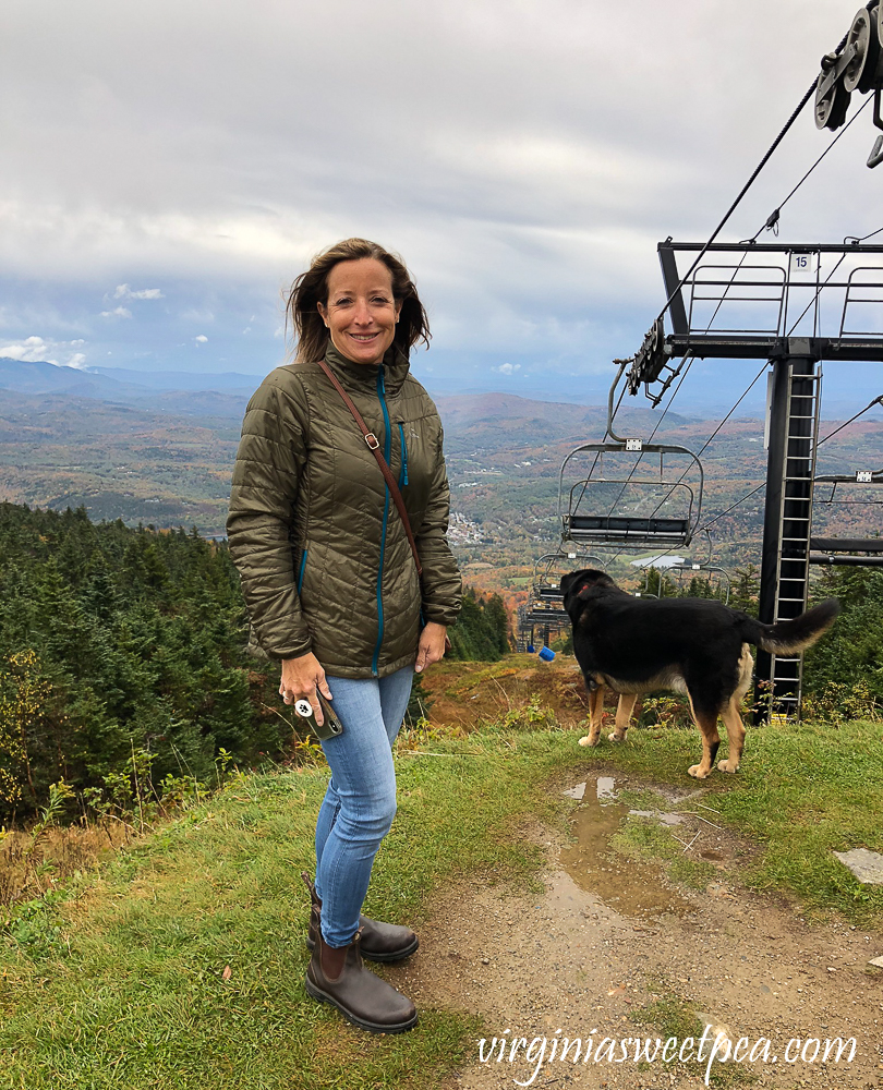 Ski lift, woman, dog on the top of Okemo Mountain, Vermont
