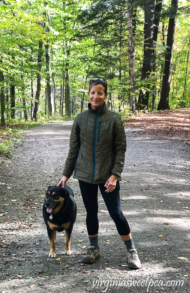 Woman and dog on a carriage trail on Mount Tom, Vermont