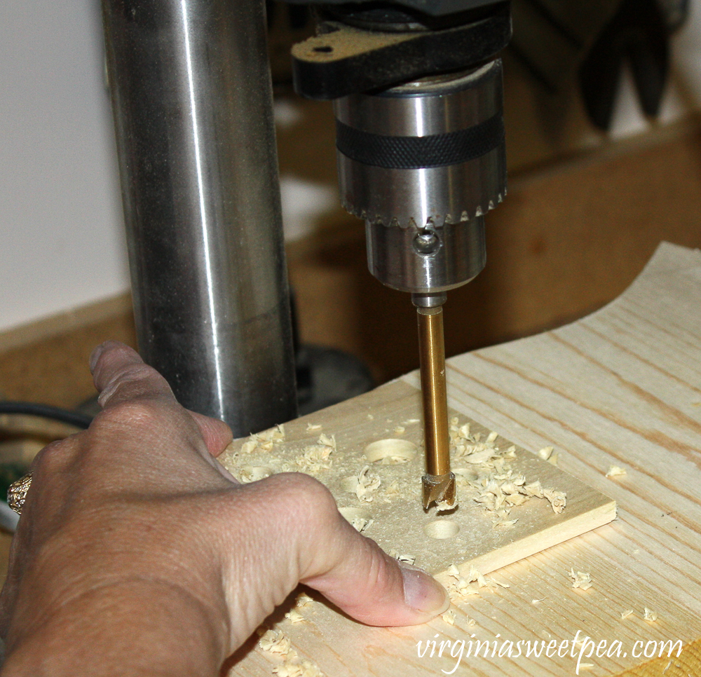 Using a drill press to make holes in wood