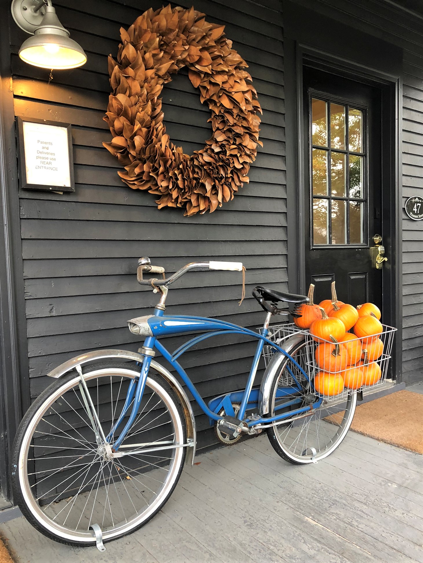 Vintage Bicycle with a bike basket filled with orange pumpkins