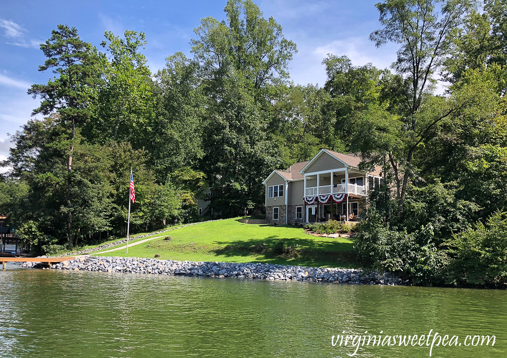 Smith Mountain Lake, VA home with riprap shoreline and flagpole with American flag