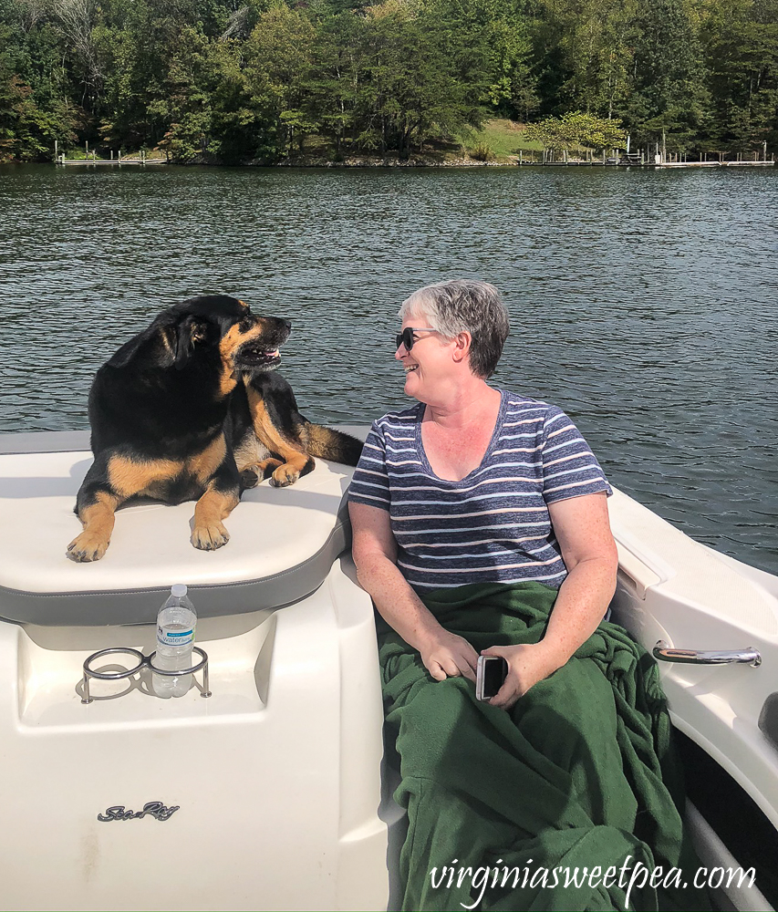 Dog and woman on a boat at Smith Mountain Lake, VA.