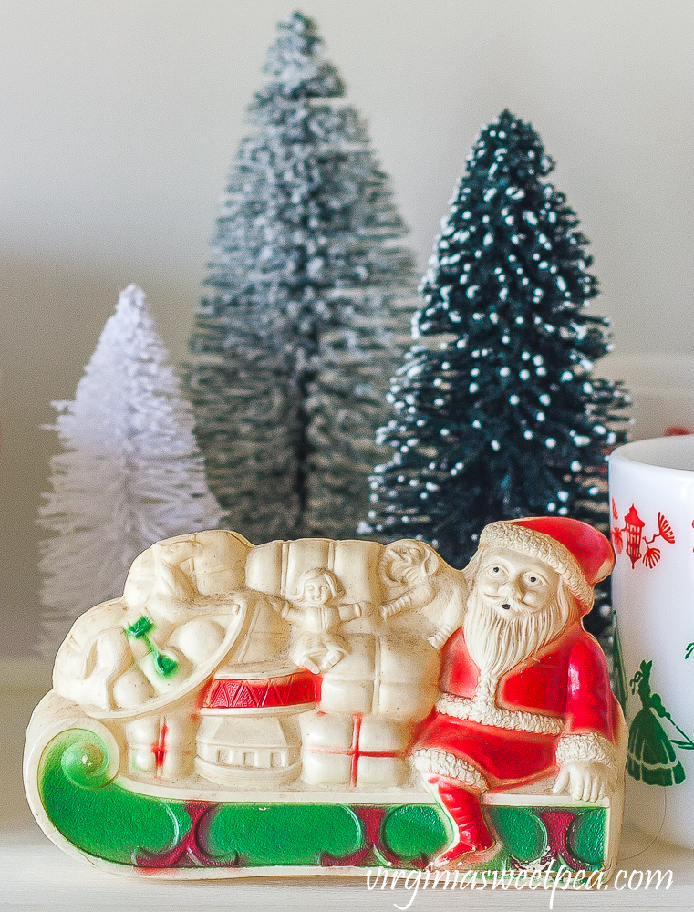 Vintage celluloid Santa with bottlebrush trees