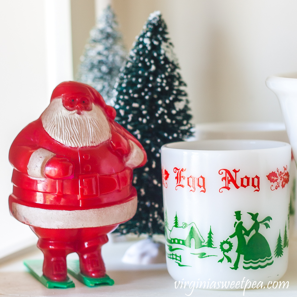 Vintage Santa candy holder with bottlebrush trees and an eggnog cup