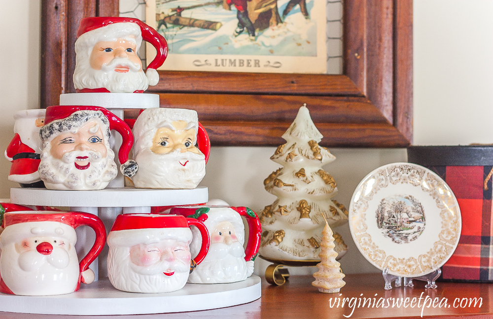 Vintage Santa mugs with vintage Christmas candles and a Knowles plate