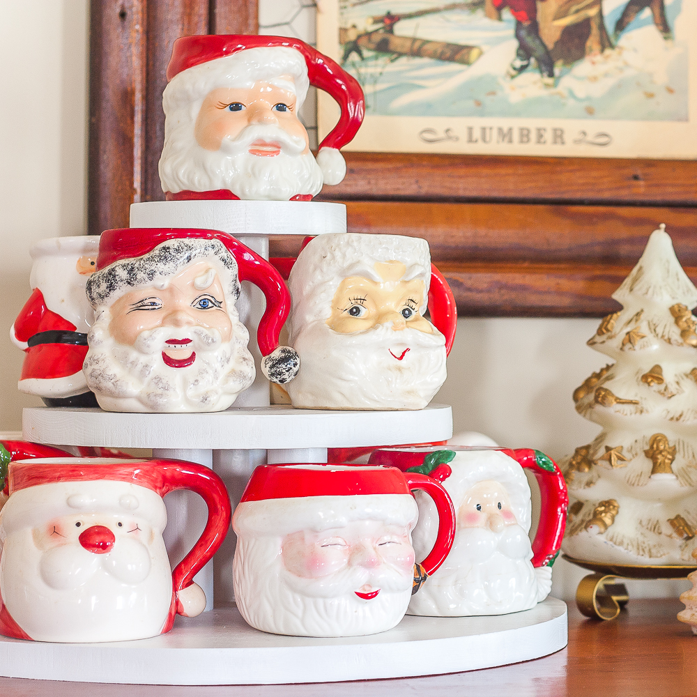 Santa mugs displayed on a three level display stand