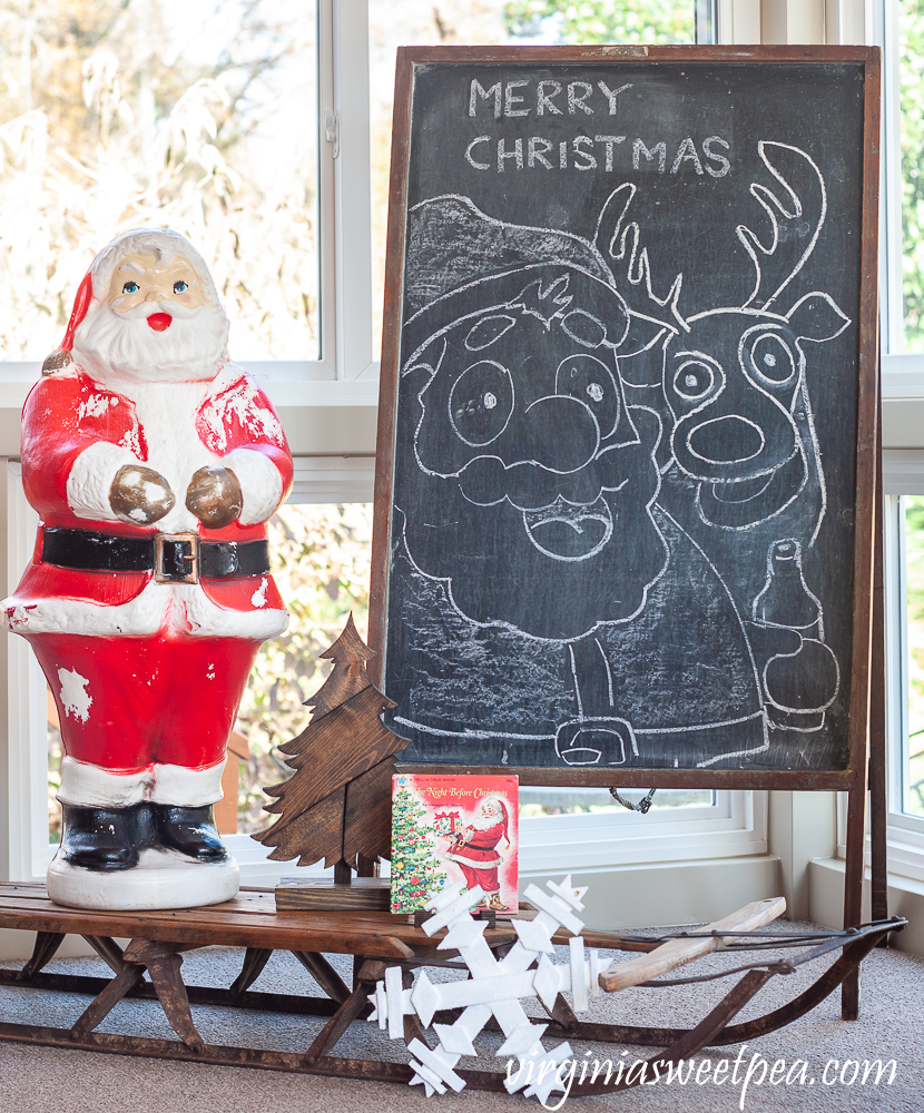 Vintage Blow Mold Santa with wood sled from the 1970s and Santa and reindeer chalk art