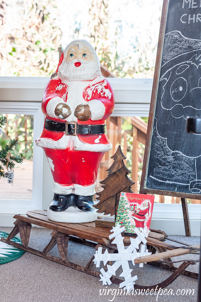 Vintage Blow Mold Santa with wood sled from the 1970s