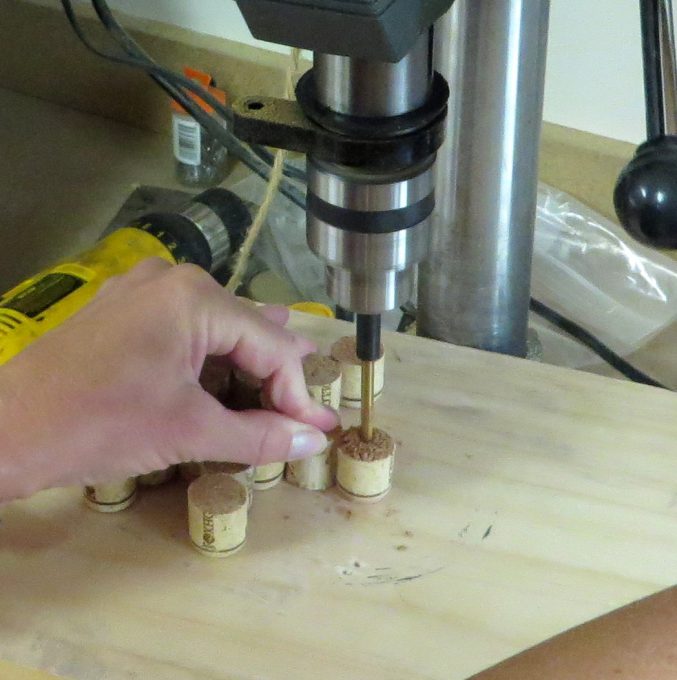 Drilling a hole in a wine cork using a drill press