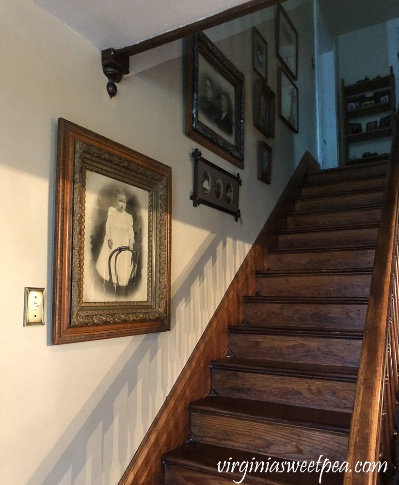 Antique Framed Family Pictures on a Stairwell