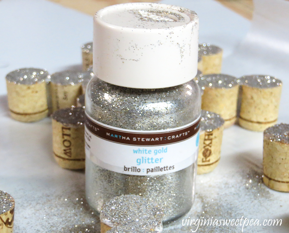 Wine cork halves with silver glittered ends using Martha Stewart white gold glitter