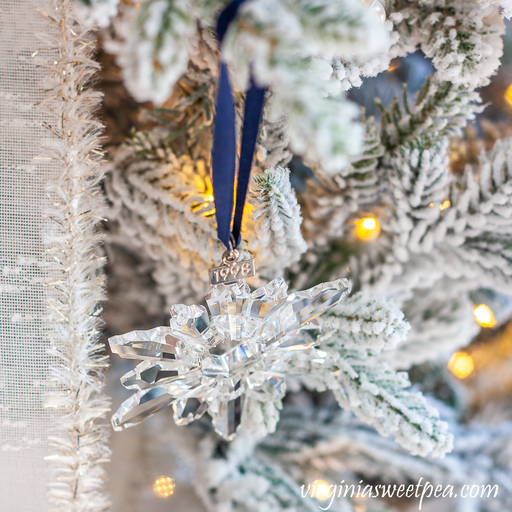 1998 Swarovski snowflake ornament on a tree decorated with a snowflake theme