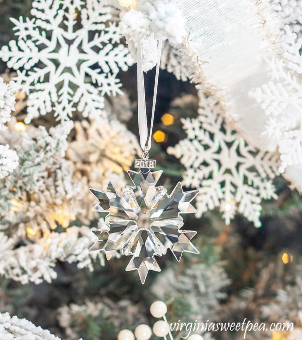 2018 Swarovski crystal snowflake ornament on a Christmas tree decorated with a snowflake theme