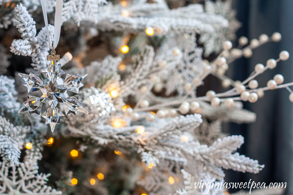 2010 Swarovski crystal snowflake ornament on a flocked Christmas tree