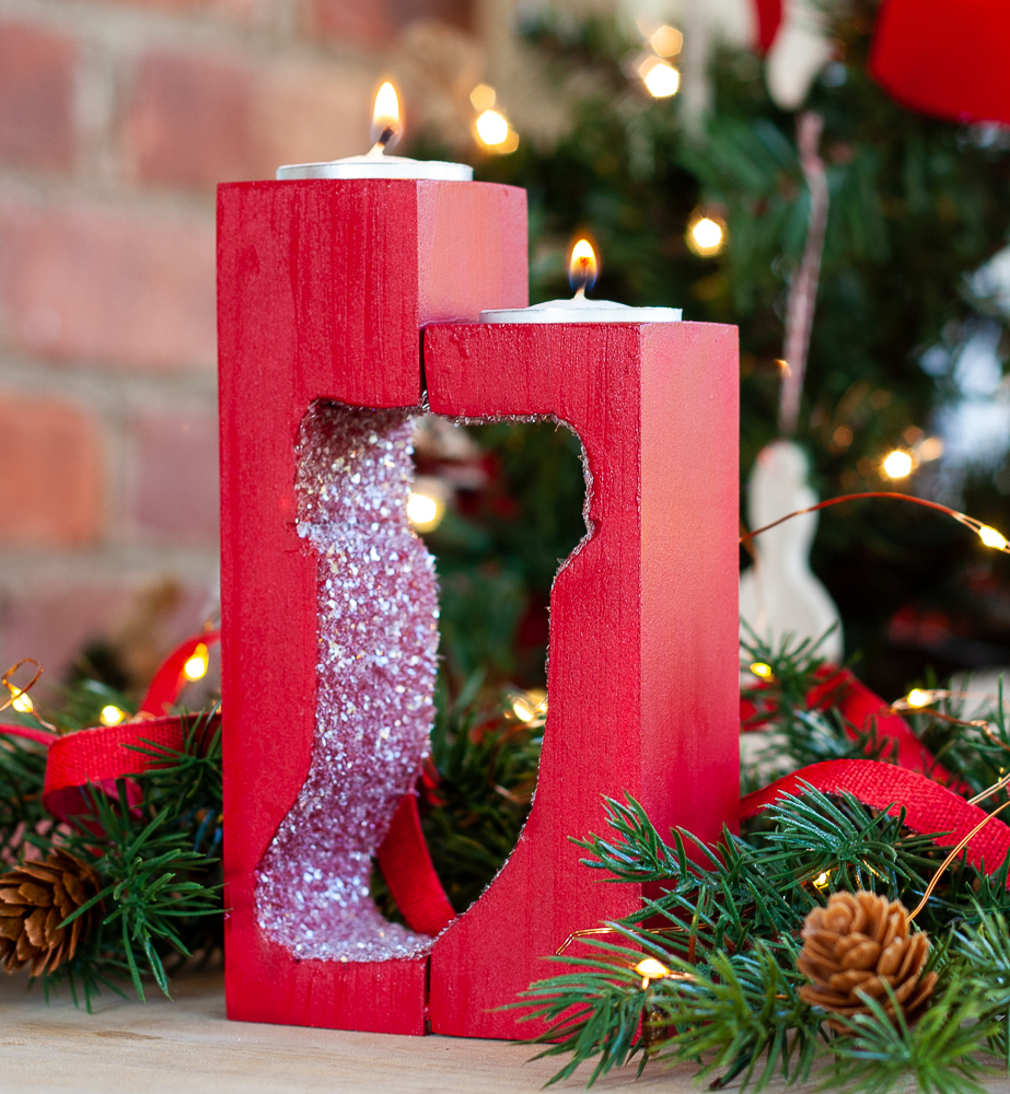 DIY Wooden Candle Holder with two tea lights and a stocking cut into the wood