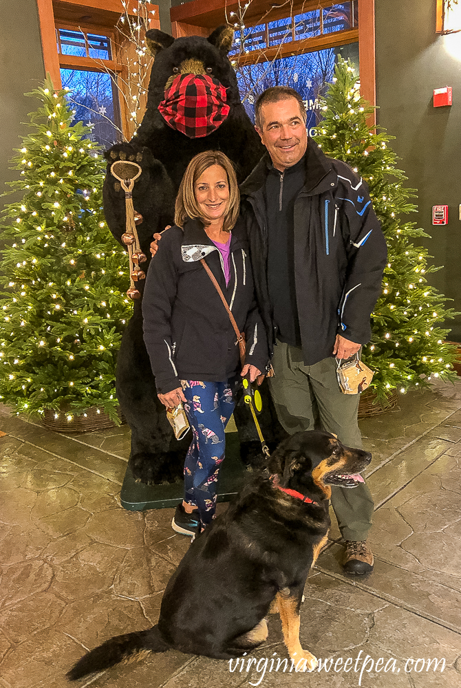 Family photo in front of a bear at Orvis in Manchester, Vermont