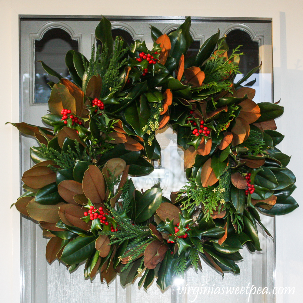 Christmas Magnolia wreath with added Holly and evergreens