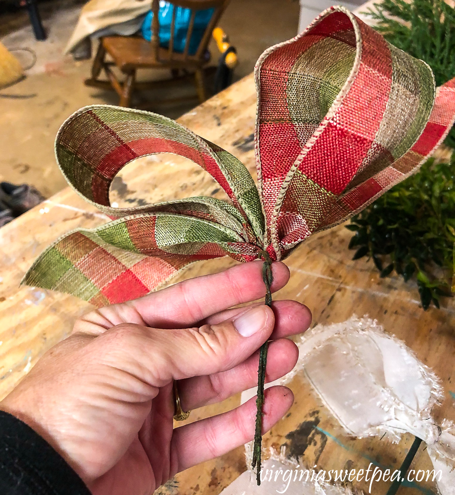 Plaid bow to add to a Christmas centerpiece