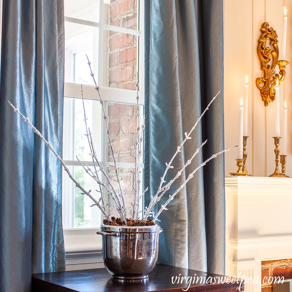 Epsom salt coated branches in a vintage silver ice bucket