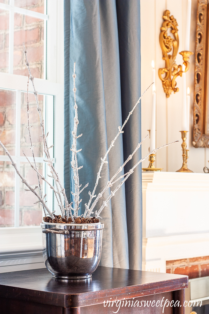 Branches frosted with Epsom salt in a vintage engraved ice bucket
