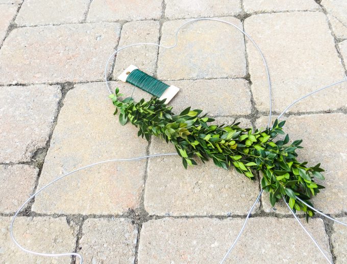 Boxwood wired to a clover shaped wire wreath form