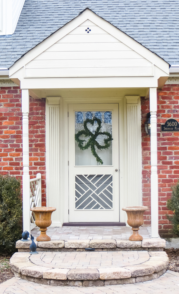 Front Door Decorated with a Boxwood clover wreath