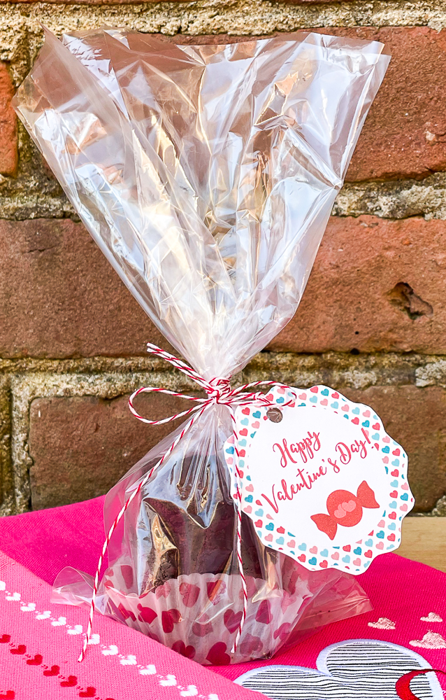 Triple Chocolate Brownies packaged in a clear bag with a heart embellished cupcake holder.