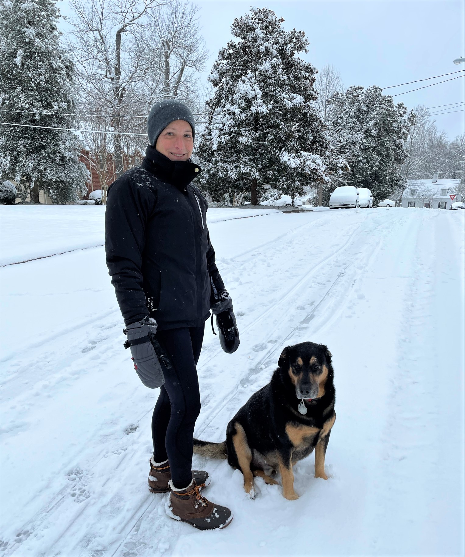 Woman and dog in the snow