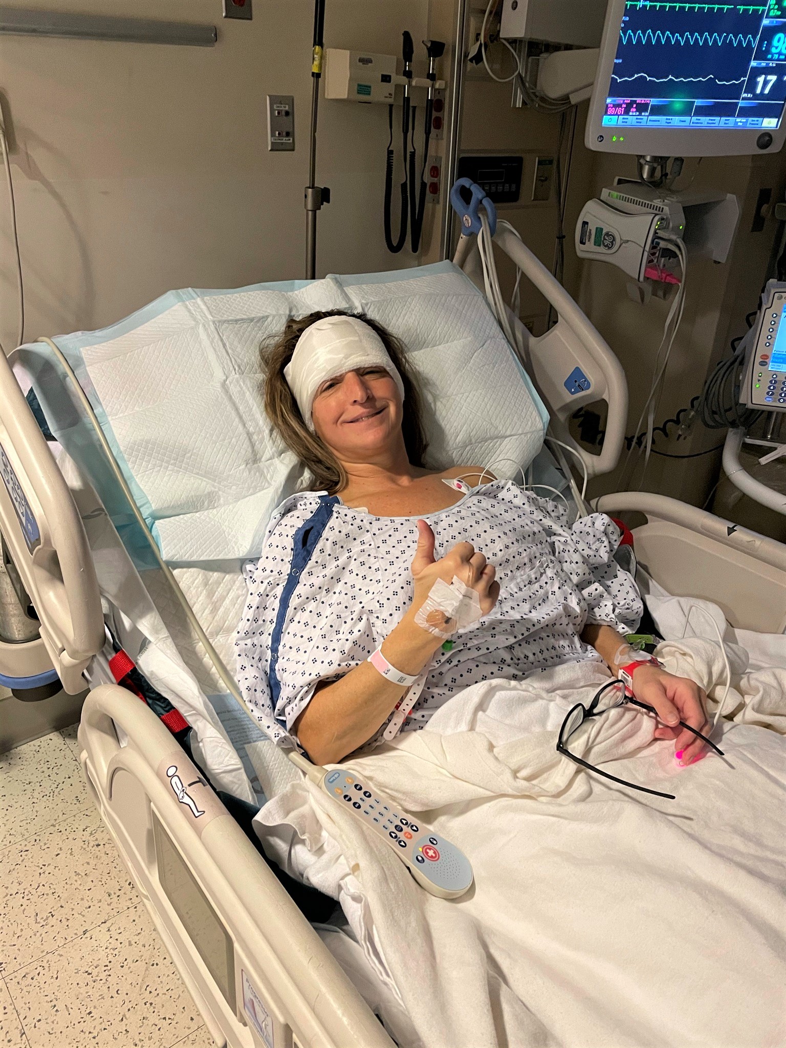 Woman in hospital bed post craniotomy